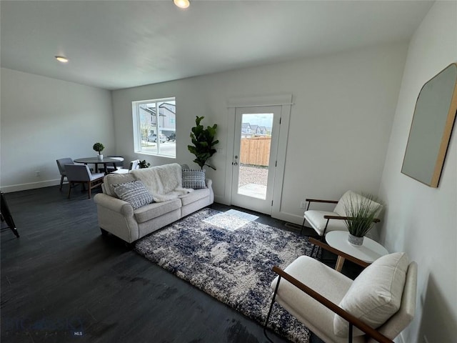 living room with dark hardwood / wood-style flooring