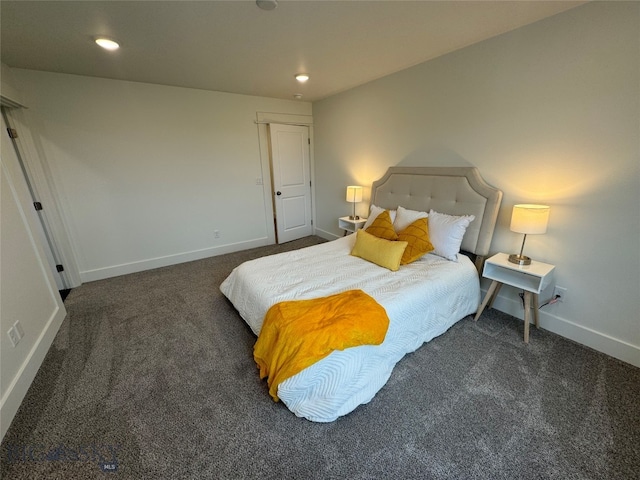 bedroom with dark colored carpet