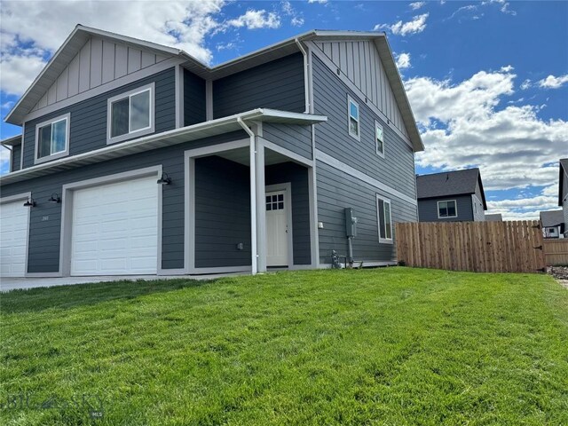 view of front property with a garage and a front lawn