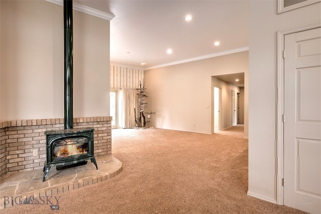 living room with crown molding, carpet, and a wood stove