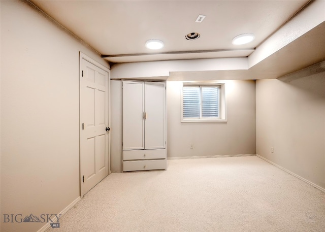 unfurnished bedroom featuring light colored carpet
