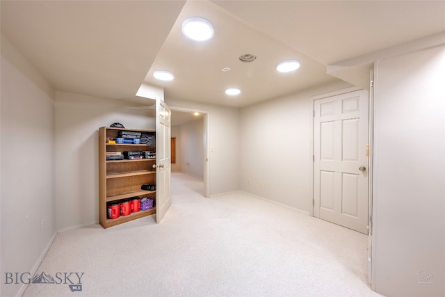 basement with light colored carpet