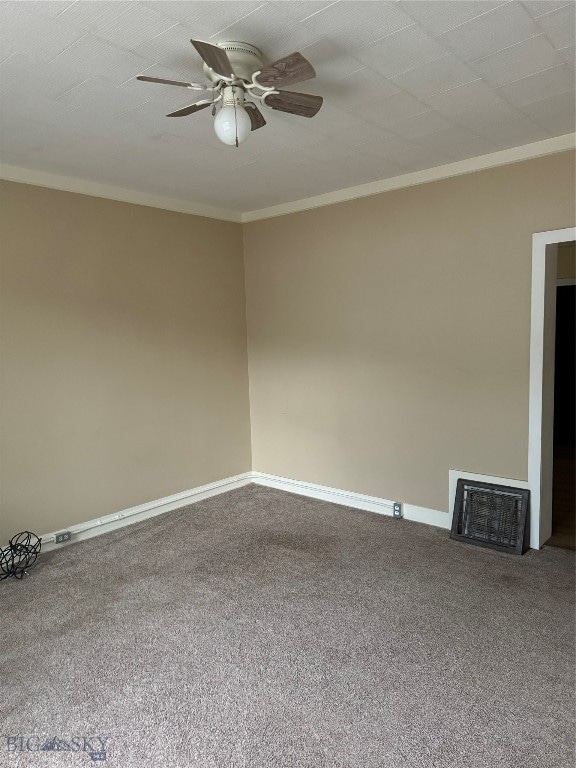 carpeted spare room with crown molding and ceiling fan