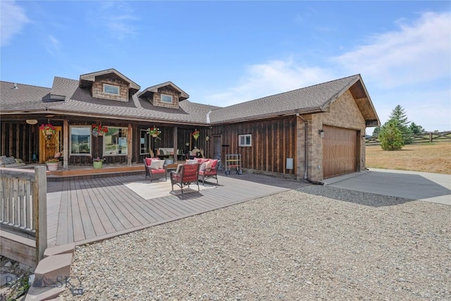310 Highpark Dr, Anaconda, MT 59711 - back of house with a garage, driveway, and a shingled roof