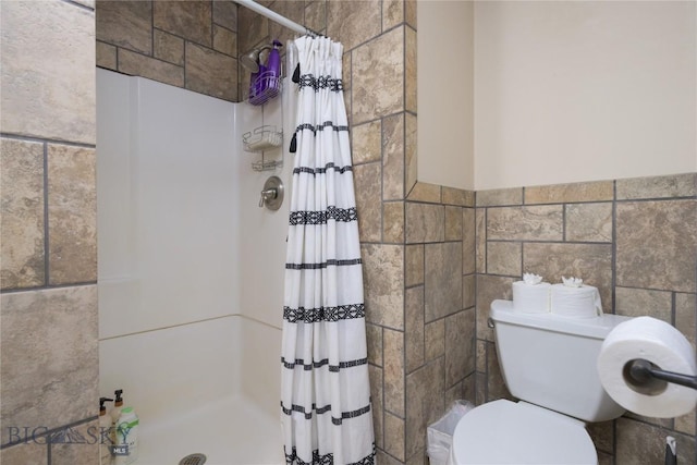 310 Highpark Dr, Anaconda, MT 59711 - full bath with tile walls, a shower stall, toilet, and wainscoting