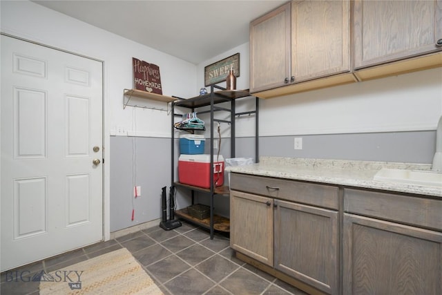 310 Highpark Dr, Anaconda, MT 59711 - mudroom with a sink and dark tile patterned flooring
