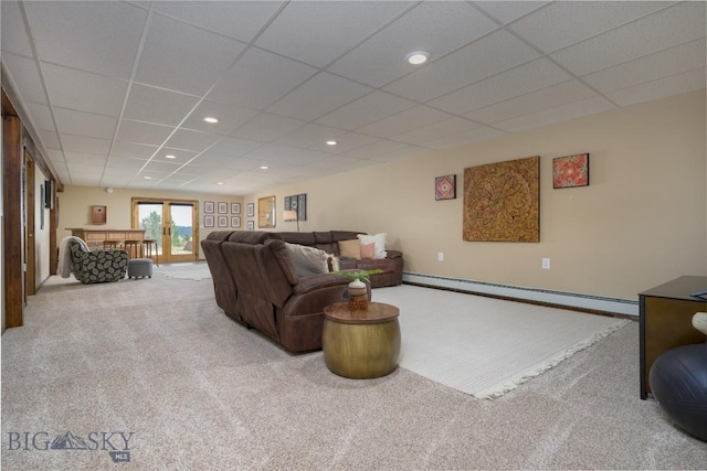 310 Highpark Dr, Anaconda, MT 59711 - carpeted living room featuring a baseboard heating unit, a drop ceiling, and baseboards