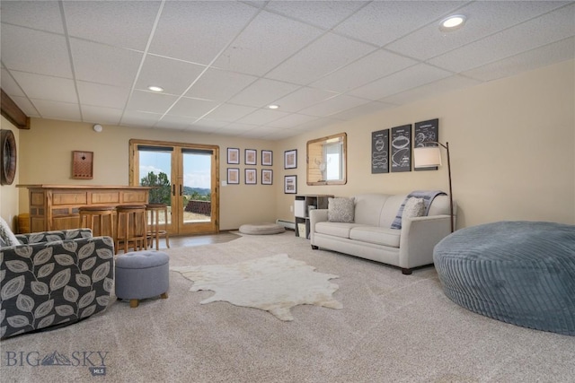 310 Highpark Dr, Anaconda, MT 59711 - living room featuring carpet, a drop ceiling, a baseboard radiator, and recessed lighting