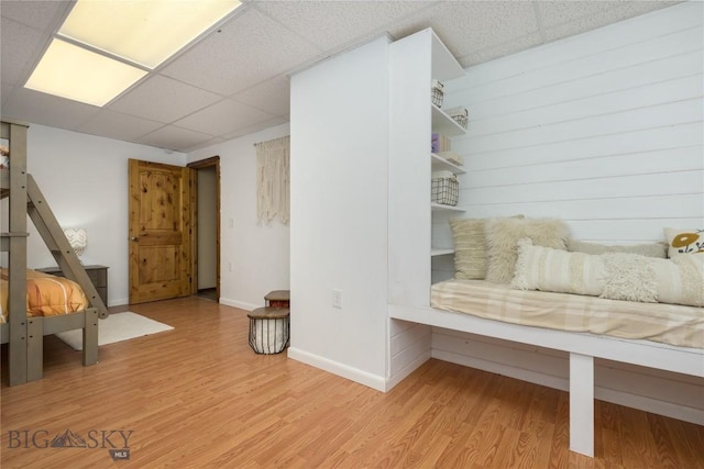 310 Highpark Dr, Anaconda, MT 59711 - living area featuring a paneled ceiling, light wood-style floors, and baseboards