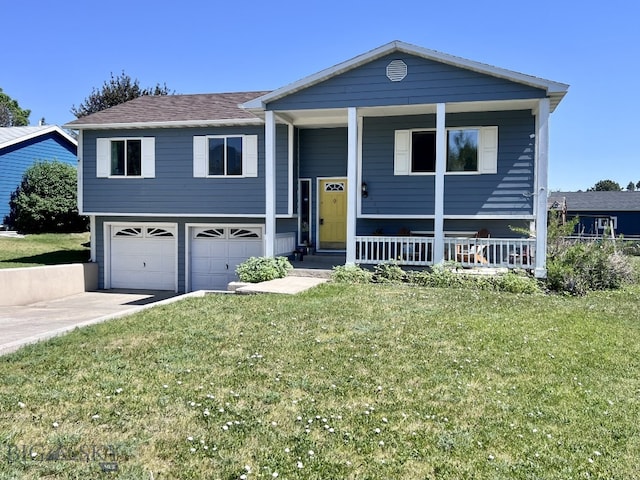 raised ranch with a front yard, a porch, and a garage