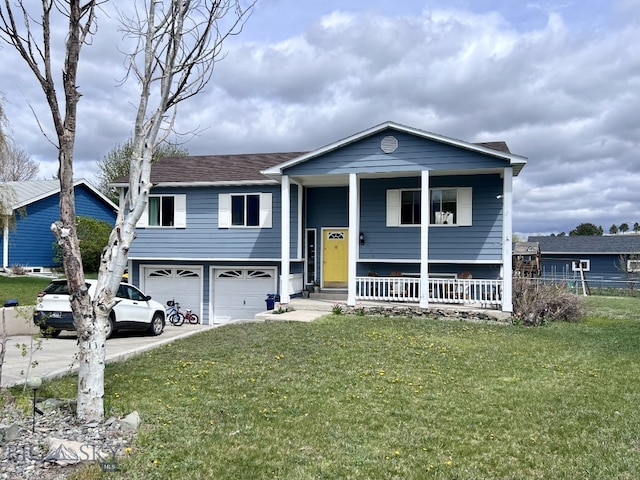 view of front of home featuring a garage, a front lawn, and a porch