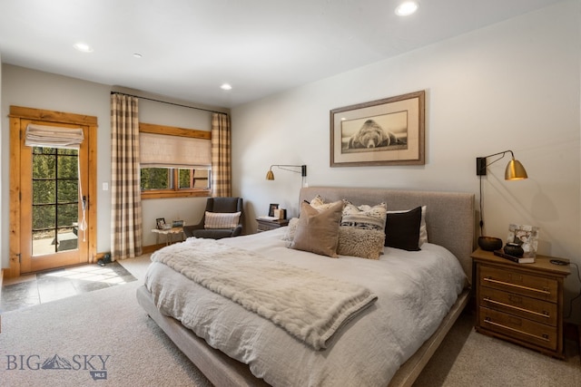 carpeted bedroom featuring access to outside