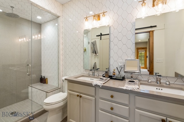 bathroom featuring walk in shower, tile walls, vanity, and toilet