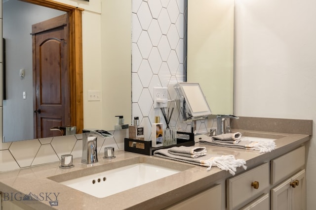 bathroom featuring backsplash and vanity