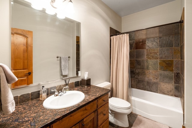 full bathroom featuring vanity, shower / bath combo with shower curtain, and toilet