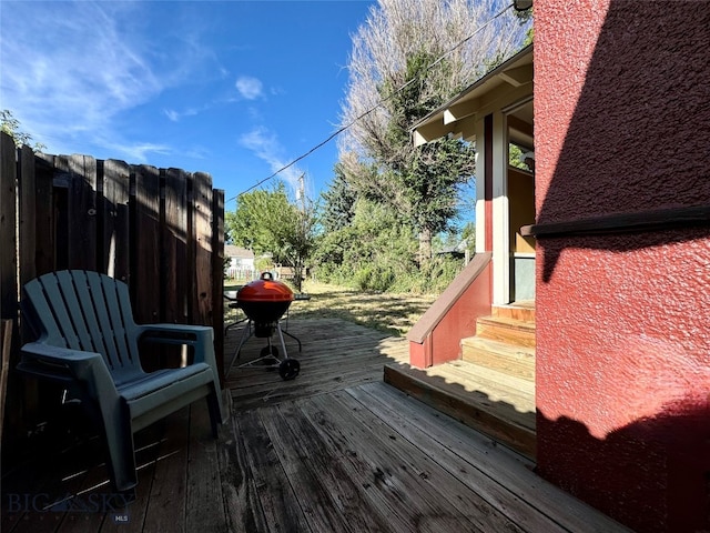 wooden terrace featuring area for grilling