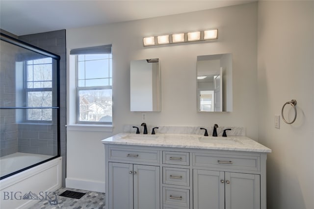 bathroom featuring tile patterned floors, vanity, and bath / shower combo with glass door