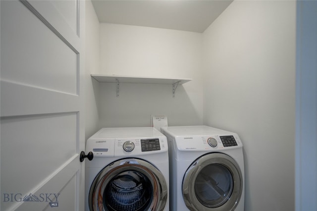 clothes washing area featuring washing machine and dryer