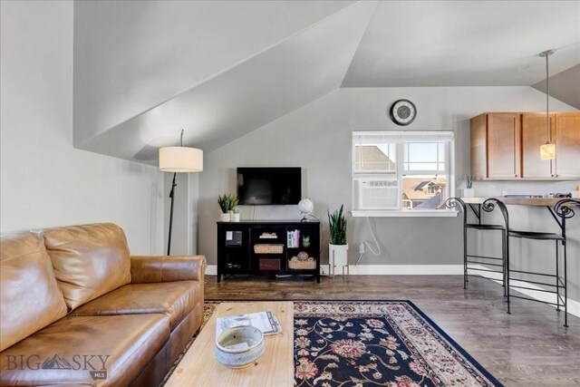 living room featuring lofted ceiling and dark hardwood / wood-style floors