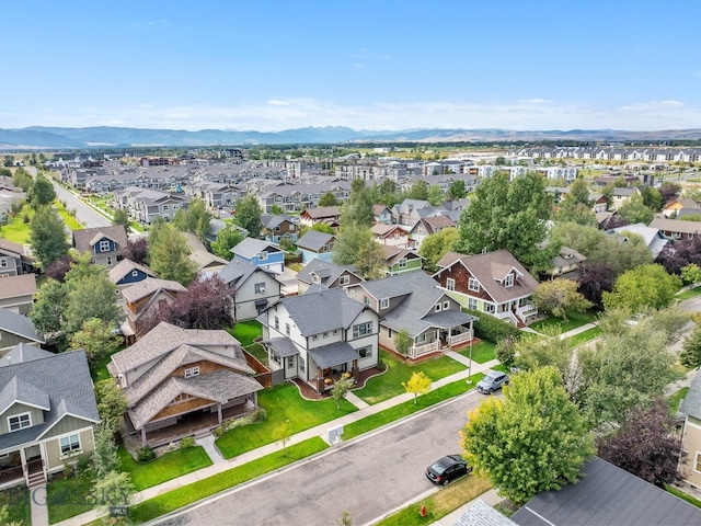 birds eye view of property with a mountain view