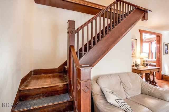 stairs featuring wood-type flooring