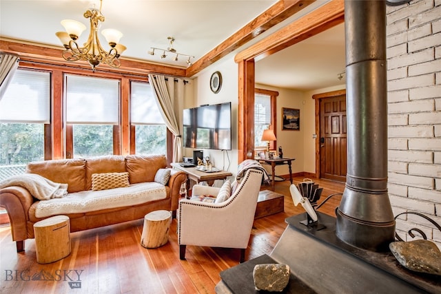 living room with a chandelier and hardwood / wood-style floors