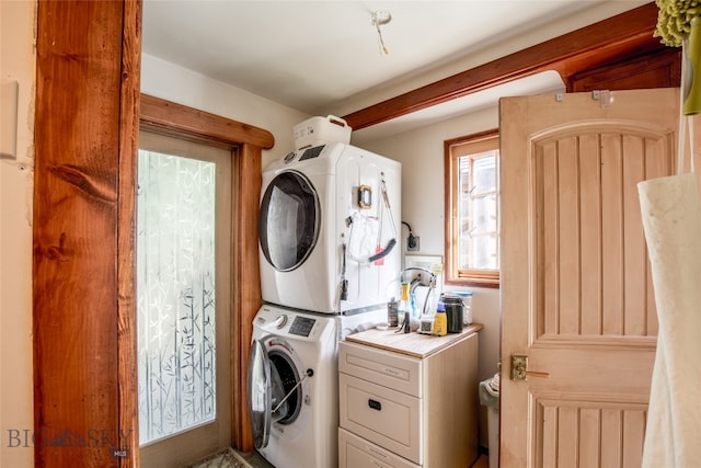 laundry room with stacked washing maching and dryer