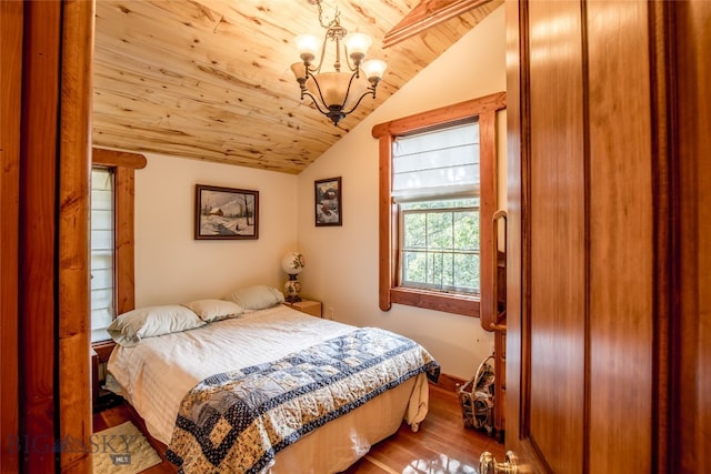 bedroom with lofted ceiling, wood-type flooring, and wood ceiling