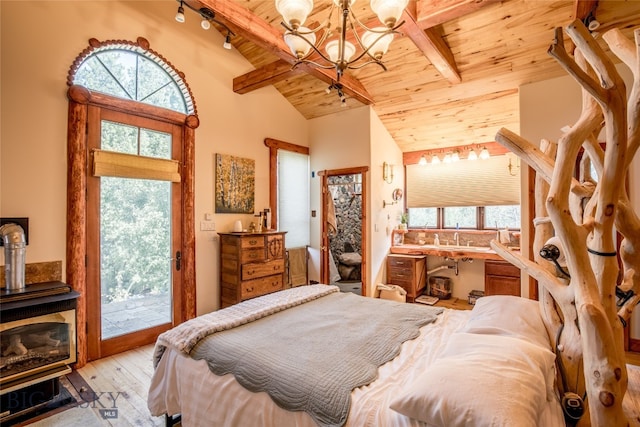 bedroom featuring an inviting chandelier, vaulted ceiling with beams, a wood stove, light wood-type flooring, and wood ceiling