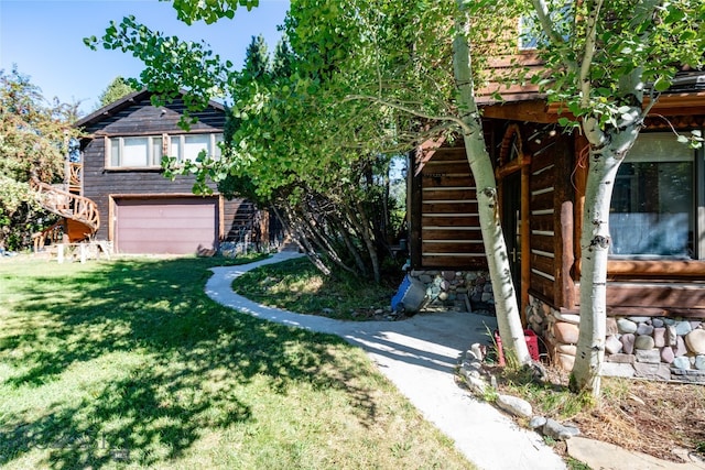 view of front facade with a front yard and a garage