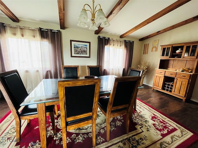 dining area featuring dark wood-type flooring, an inviting chandelier, and beam ceiling