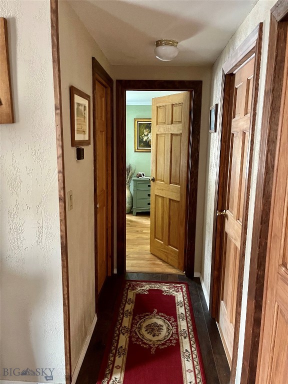 hall with dark hardwood / wood-style floors