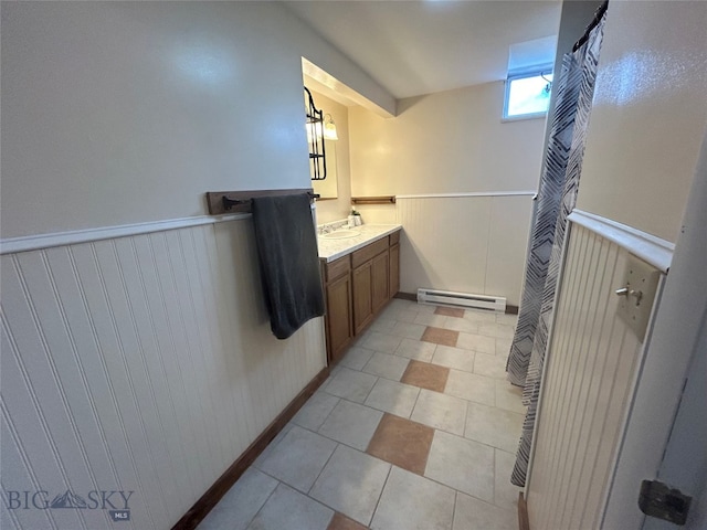 bathroom featuring walk in shower, vanity, wooden walls, and baseboard heating