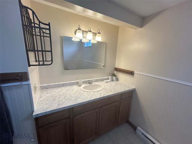 bathroom with vanity, tile patterned floors, and a baseboard radiator