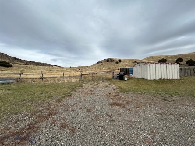 view of road featuring a rural view and a mountain view