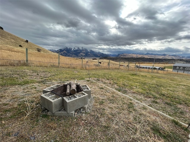 view of yard featuring a mountain view and a rural view