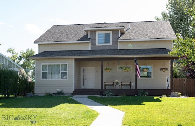 view of front of house with covered porch and a front yard