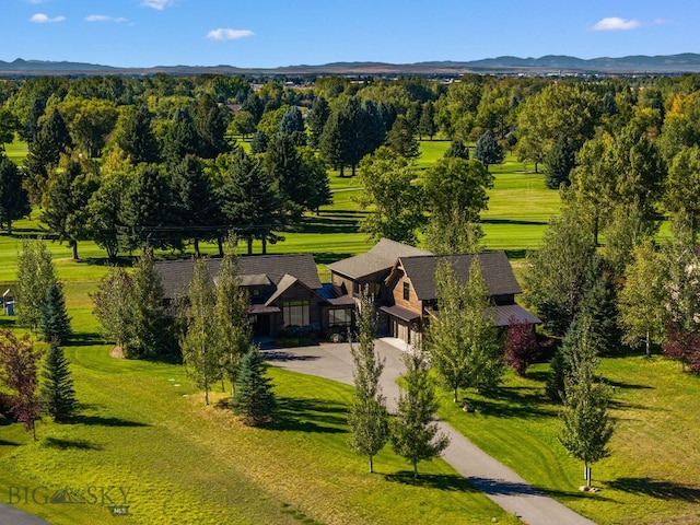 birds eye view of property with a mountain view