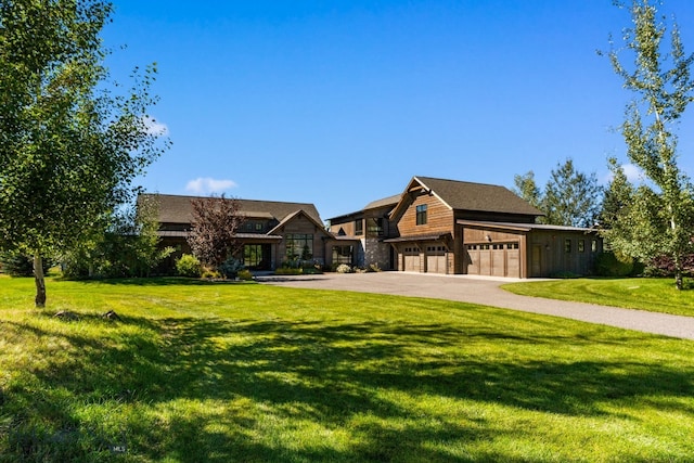 view of front facade featuring a front yard and a garage