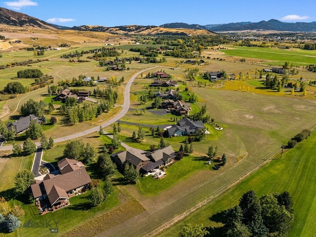 aerial view featuring a rural view and a mountain view