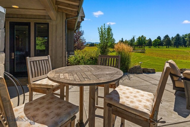 view of patio / terrace with a rural view