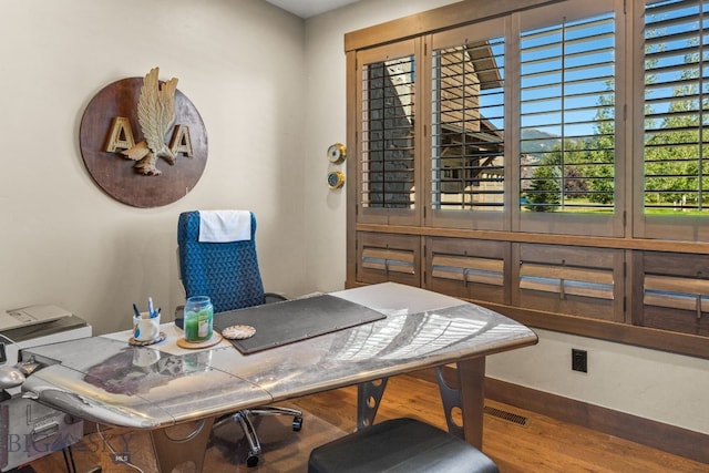 home office featuring hardwood / wood-style floors