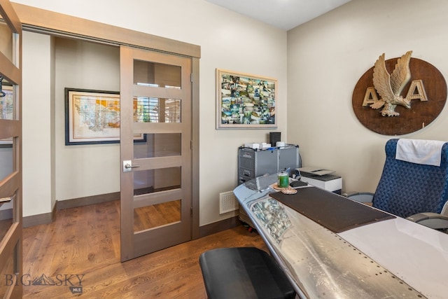 home office featuring hardwood / wood-style floors