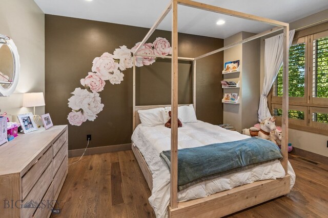 bedroom featuring dark wood-type flooring