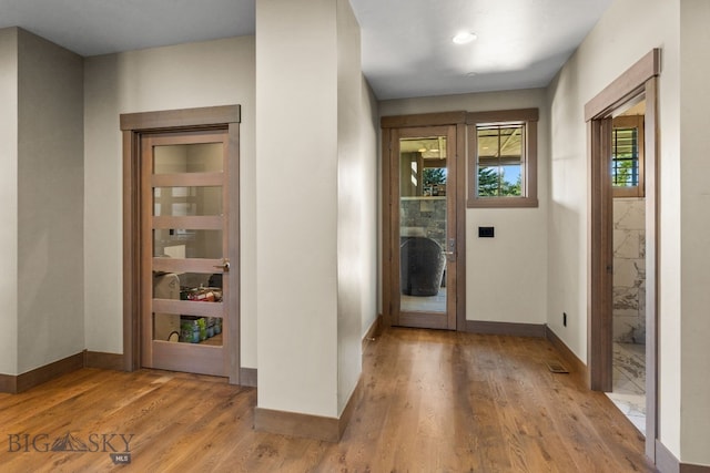 foyer entrance with light wood-type flooring