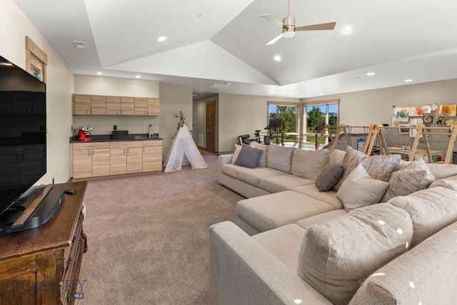 living room with lofted ceiling, light carpet, ceiling fan, and sink