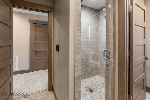 bathroom with an enclosed shower