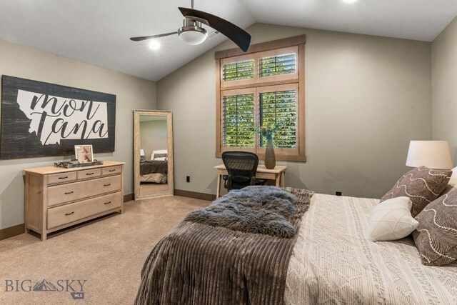 carpeted bedroom featuring ceiling fan and vaulted ceiling