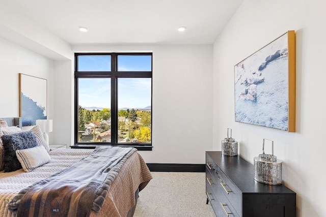 bedroom with carpet floors and baseboards