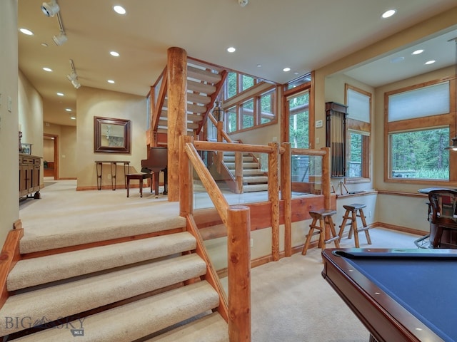 stairs featuring billiards, carpet, and a wealth of natural light